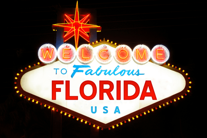 A neon welcome sign that says, "Welcome to Fabulous Florida, USA."