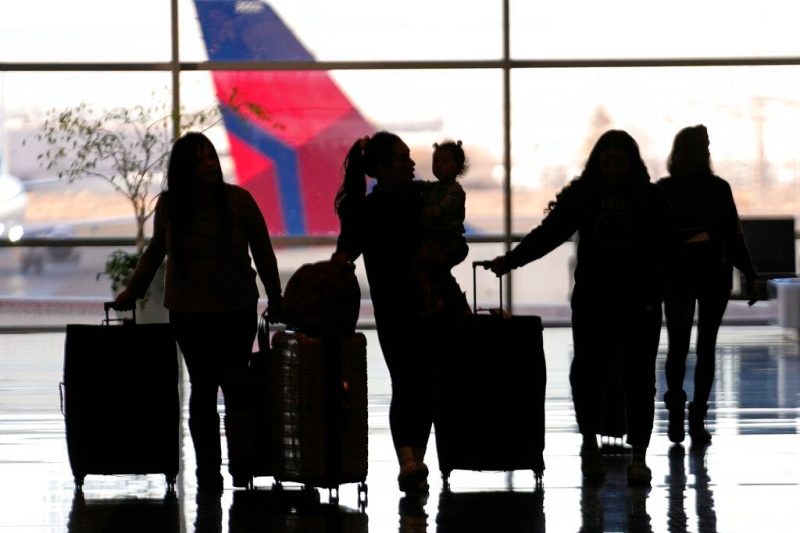 People pass through Salt Lake City International Airport, Wednesday, Jan. 11, 2023, in Salt Lake City. Thousands of travelers were stranded at U.S. airports due to an hours-long computer outage. If a flight is canceled, experts say most airlines will rebook you on the next available flight. But if you choose to cancel the trip, airlines must provide you with a full refund. (AP Photo/Rick Bowmer)