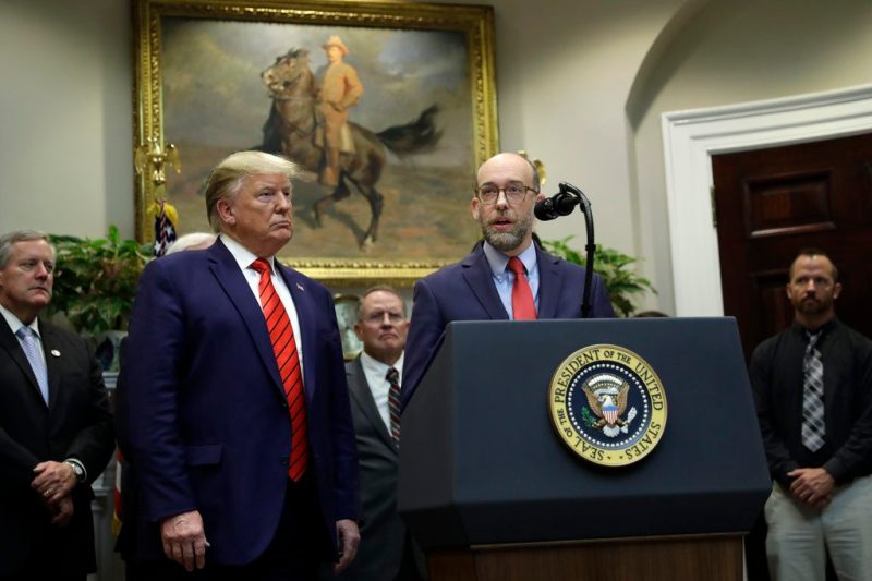 FILE - President Donald Trump listens as acting director of the Office of Management and Budget Russel Vought speaks during an event on "transparency in Federal guidance and enforcement" in the Roosevelt Room of the White House, Wednesday, Oct. 9, 2019, in Washington. (AP Photo/Evan Vucci, File)
