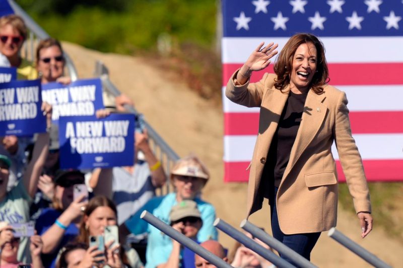 Democratic presidential nominee Vice President Kamala Harris waves as she steps on stage to address a crowd, Wednesday, Sept. 4, 2024, during a campaign stop, in North Hampton, N.H. (AP Photo/Steven Senne)