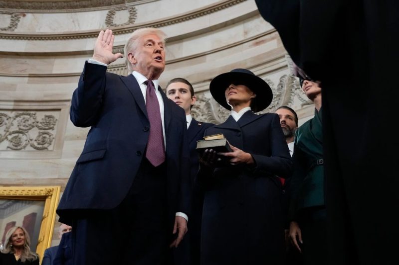 Donald Trump is sworn in as the 47th president of the United States by Chief Justice John Roberts as Melania Trump holds the Bible during the 60th Presidential Inauguration in the Rotunda of the U.S. Capitol in Washington, Monday, Jan. 20, 2025. (Photo by Morry Gash / POOL / AFP) (Photo by MORRY GASH/POOL/AFP via Getty Images)